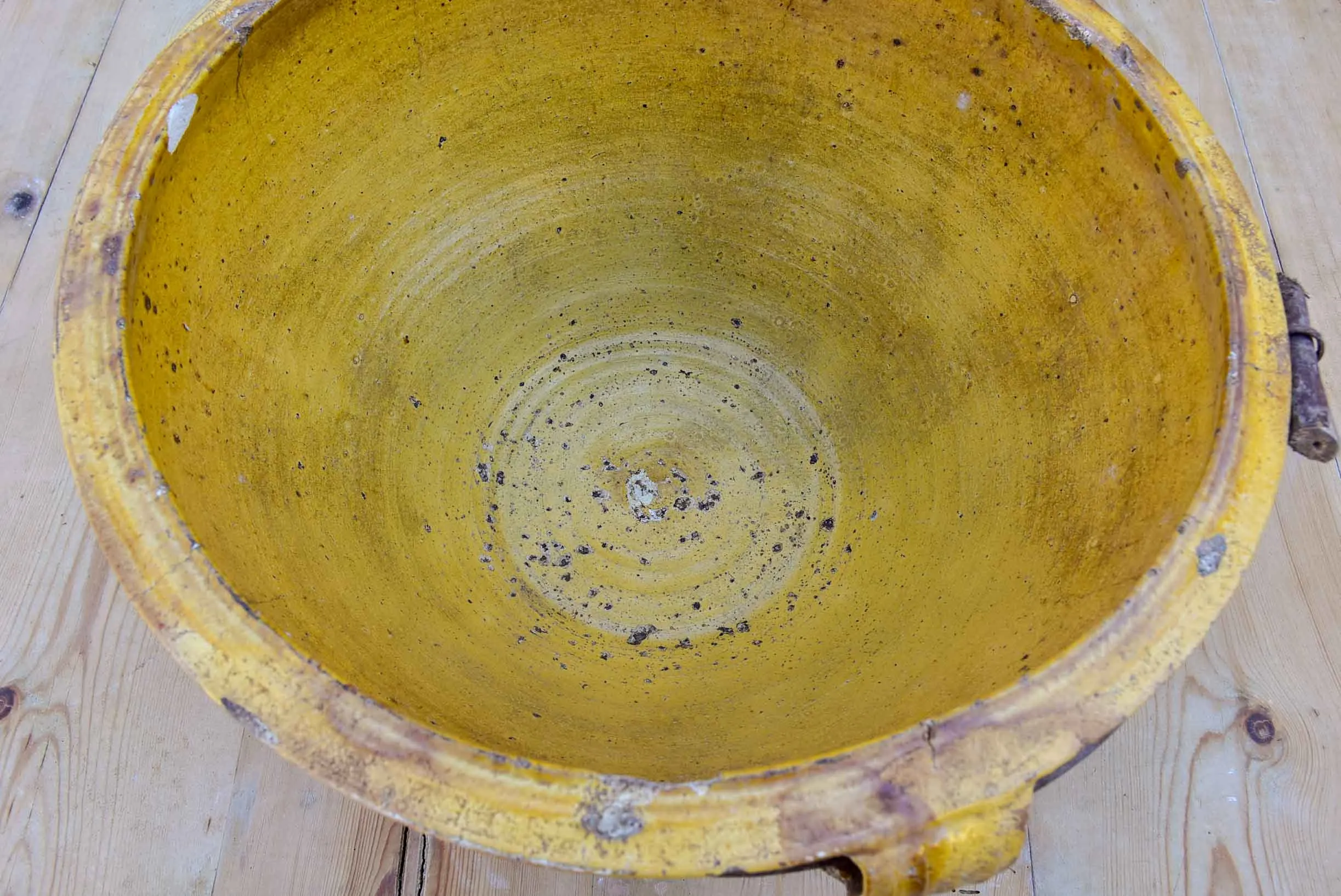 Large antique terracotta bowl with yellow glaze